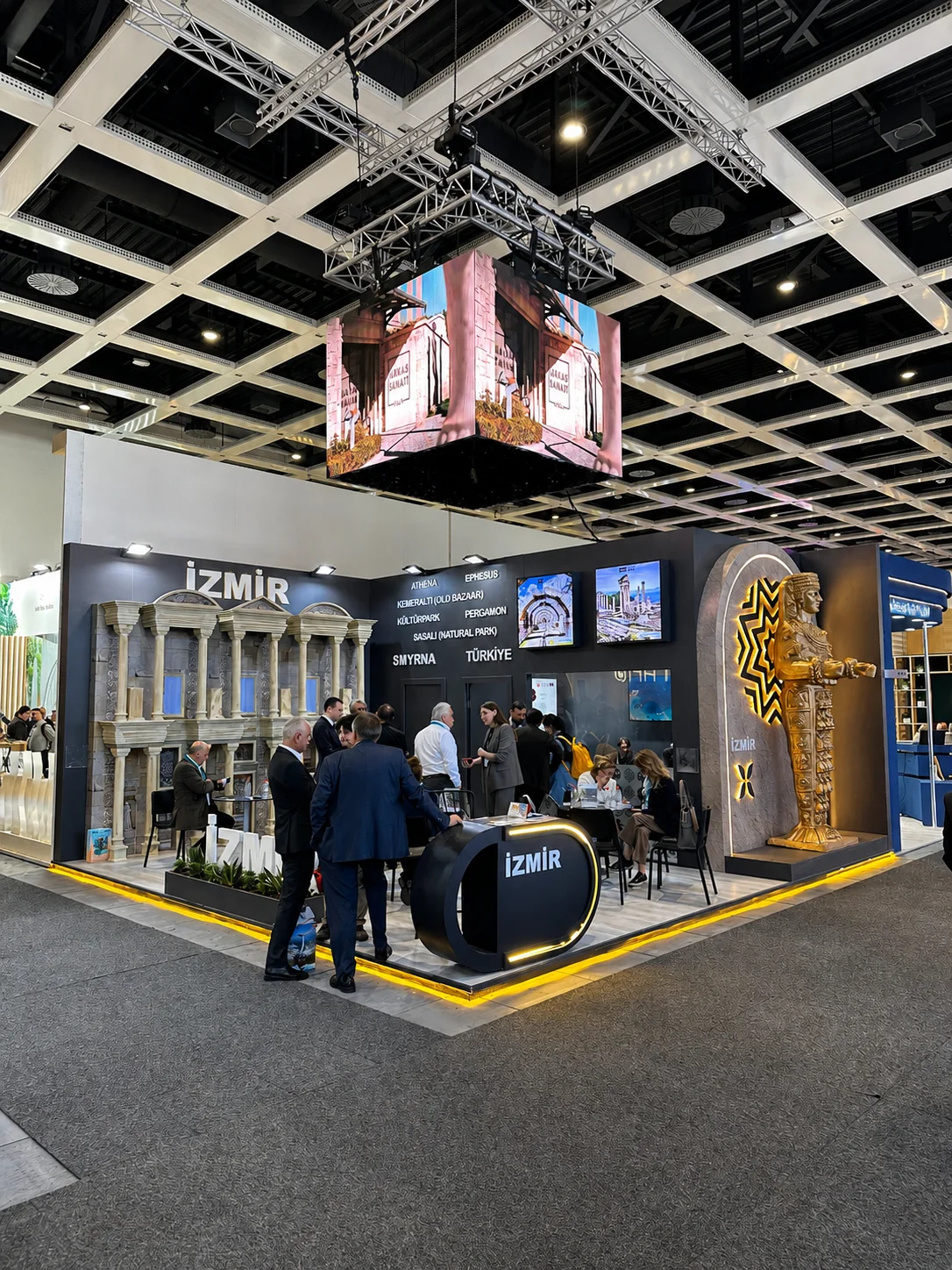 İzmir exhibition stand with suspended LED cube and visitor meeting areas at ITB Berlin